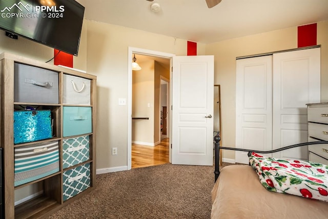 bedroom with carpet and a closet