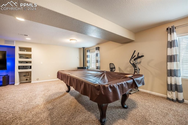 game room featuring a textured ceiling, pool table, and carpet