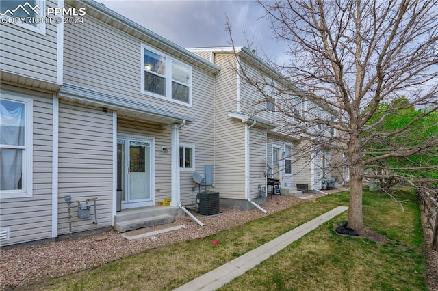 rear view of house with a yard