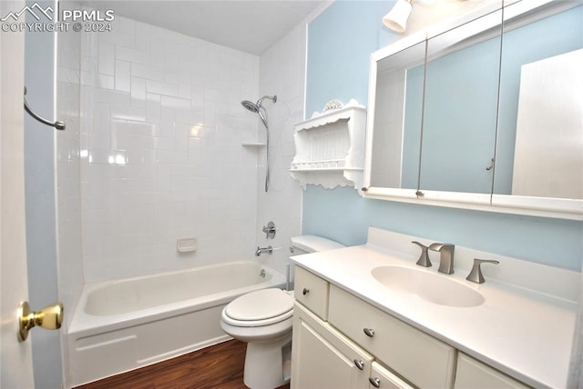 full bathroom with shower / tub combination, vanity, toilet, and wood-type flooring