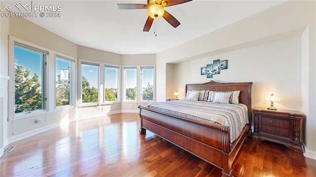 bedroom with hardwood / wood-style floors and ceiling fan