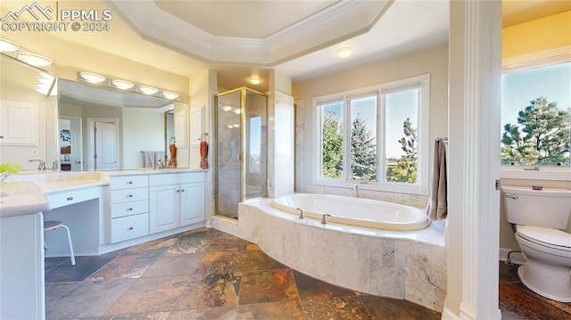 full bathroom featuring independent shower and bath, a raised ceiling, ornamental molding, vanity, and toilet