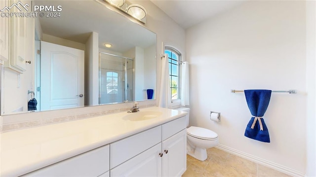 bathroom with walk in shower, vanity, tile patterned flooring, and toilet