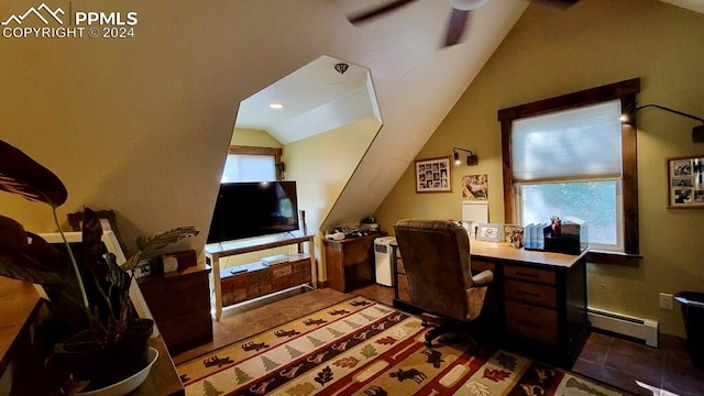 office with dark tile patterned floors, vaulted ceiling, ceiling fan, and baseboard heating