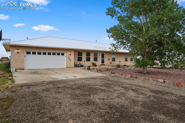 ranch-style home with a garage