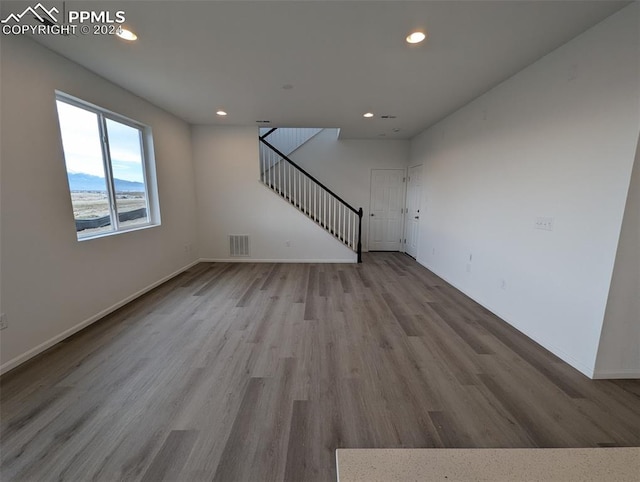 unfurnished living room with light wood-type flooring