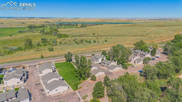 drone / aerial view with a water view and a rural view