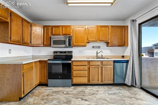 kitchen with appliances with stainless steel finishes and sink