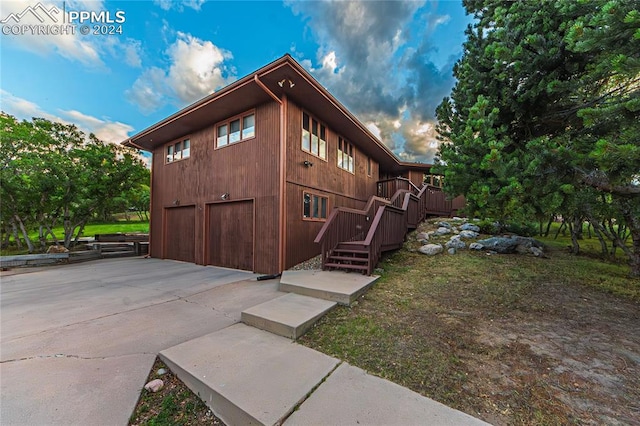 view of side of home with a garage