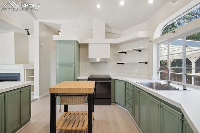 kitchen with light hardwood / wood-style flooring, green cabinetry, black range with electric stovetop, and sink