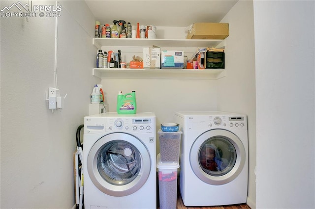 laundry area with washer and clothes dryer and wood-type flooring