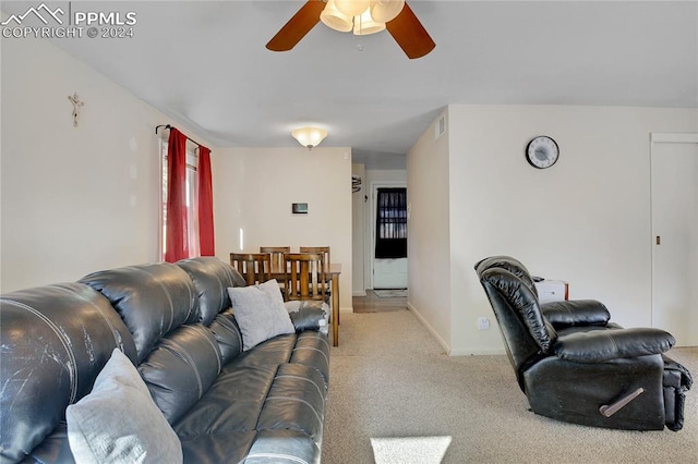 living room featuring ceiling fan and light colored carpet