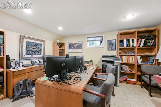 tiled office with a textured ceiling