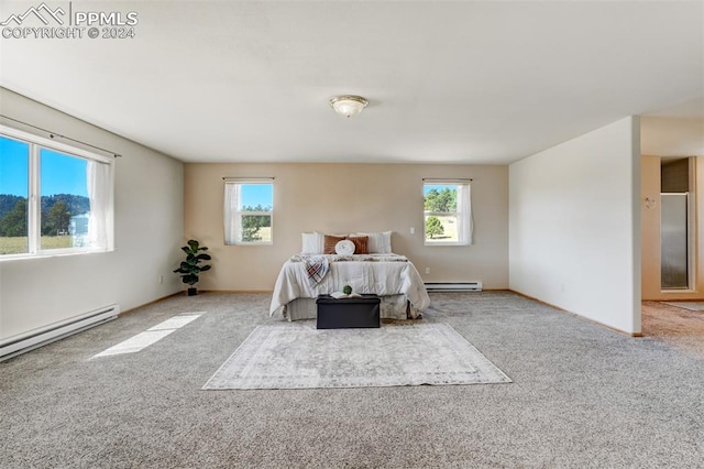 carpeted bedroom with a baseboard radiator