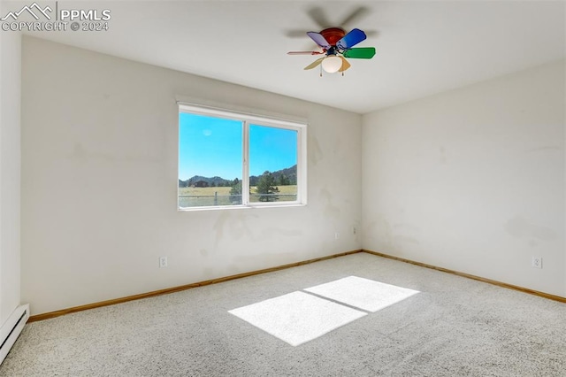 unfurnished room featuring baseboard heating and ceiling fan