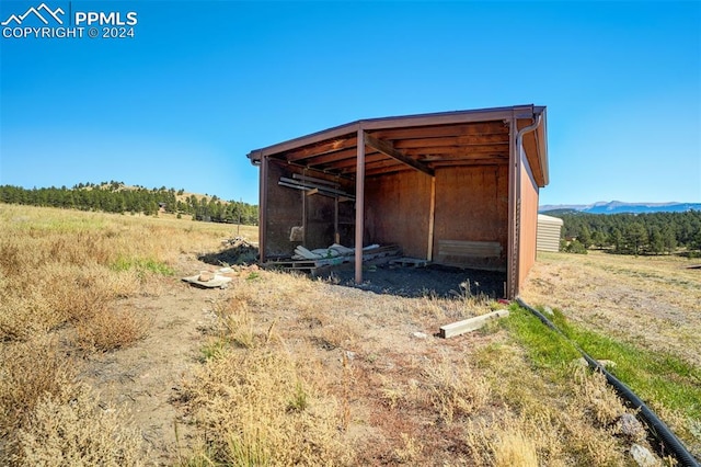 view of outbuilding with a rural view