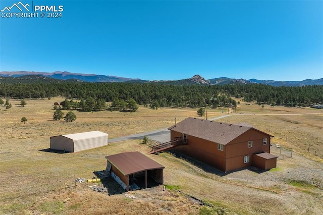 exterior space with a mountain view and a rural view