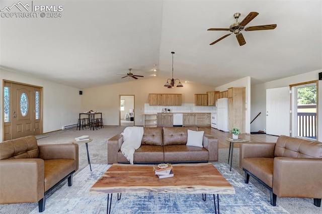 carpeted living room with ceiling fan with notable chandelier and lofted ceiling