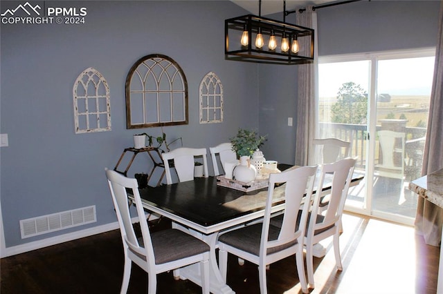 dining room with dark hardwood / wood-style floors