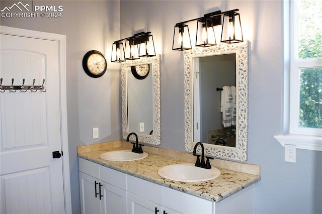 bathroom with vanity and a healthy amount of sunlight