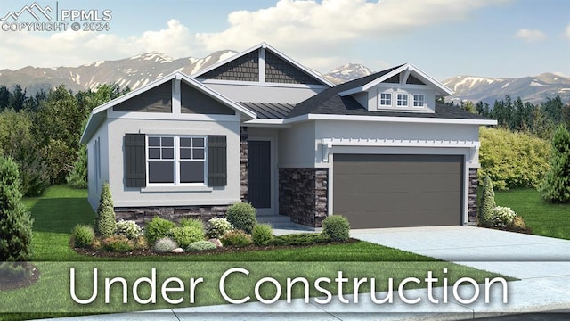 view of front facade featuring driveway, an attached garage, a standing seam roof, a mountain view, and a front lawn