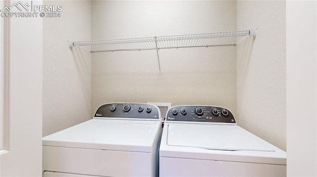 clothes washing area with independent washer and dryer