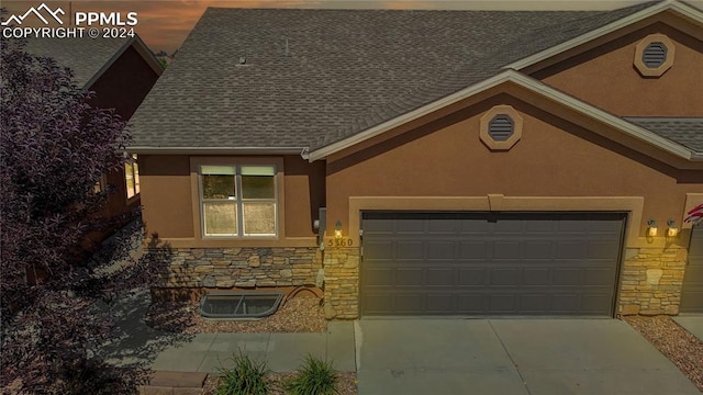 view of front of property with a garage