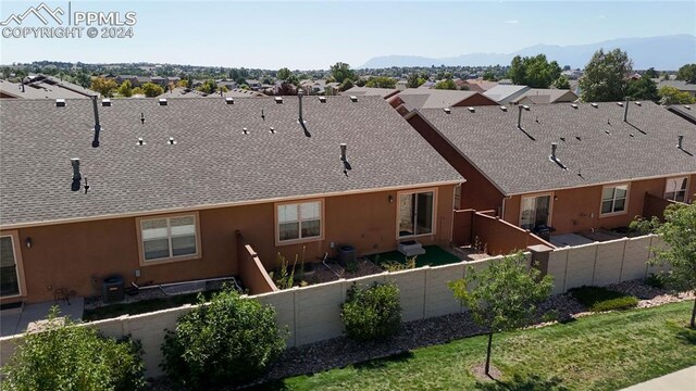 back of house featuring a mountain view