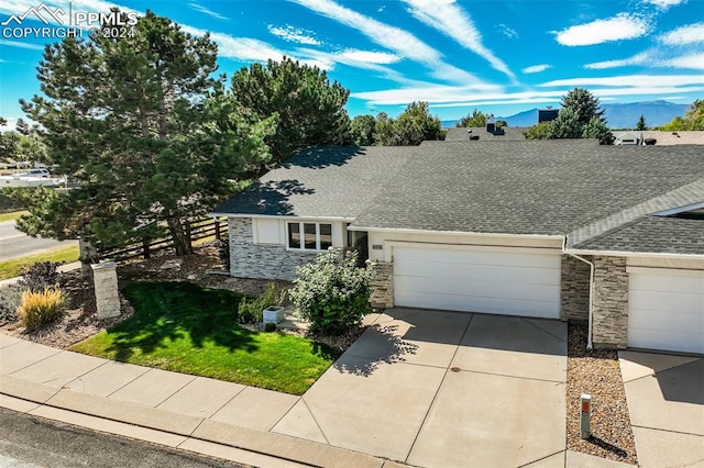 view of front of property with a garage