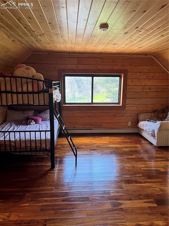 unfurnished bedroom with wooden walls, lofted ceiling, wooden ceiling, and hardwood / wood-style floors