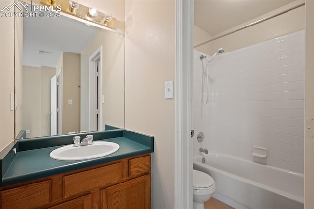 full bathroom with shower / bathing tub combination, vanity, and toilet