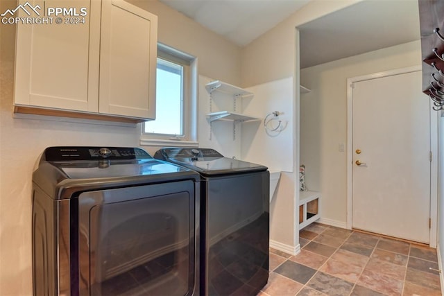 washroom with cabinets and separate washer and dryer