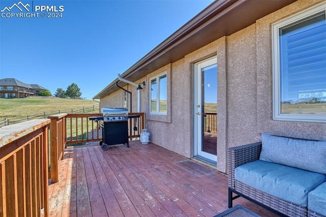 wooden deck featuring grilling area