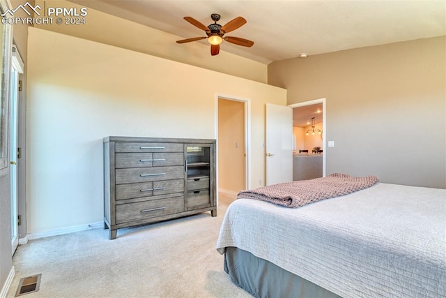 carpeted bedroom featuring vaulted ceiling and ceiling fan