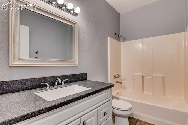 full bathroom with vanity, toilet, tile patterned floors, and shower / bath combination