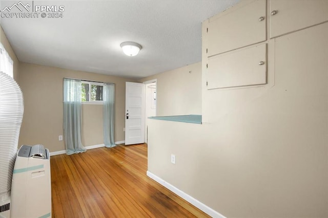 unfurnished room with light hardwood / wood-style floors