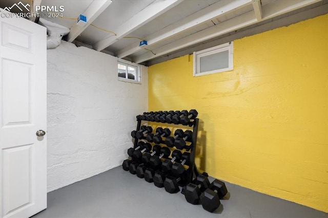 workout room featuring concrete flooring