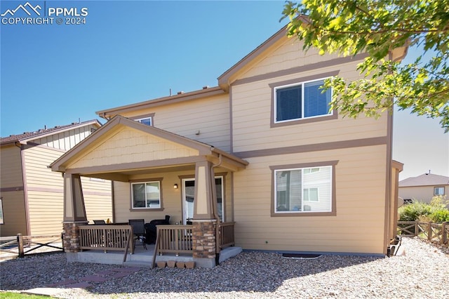 6777 Ironwood Tree Cir, Colorado Springs, CO 80927 - back of house with a porch and fence