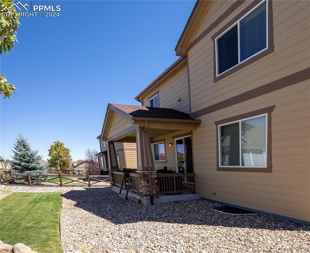 6777 Ironwood Tree Cir, Colorado Springs, CO 80927 - rear view of property featuring fence, a patio, and a yard