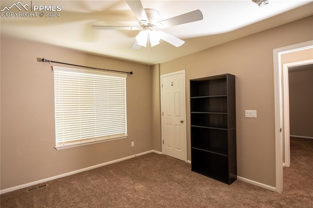 6777 Ironwood Tree Cir, Colorado Springs, CO 80927 - unfurnished bedroom featuring baseboards, visible vents, multiple windows, and carpet