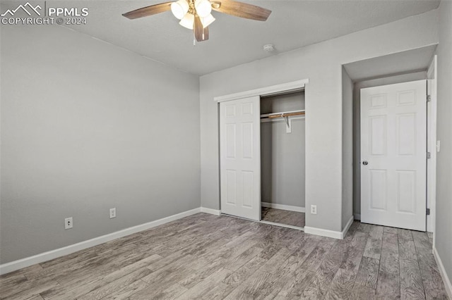 unfurnished bedroom featuring a closet, ceiling fan, and hardwood / wood-style floors