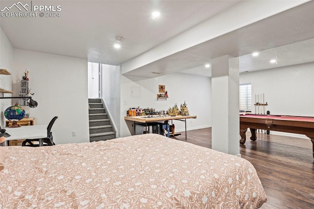 bedroom featuring pool table and dark hardwood / wood-style floors