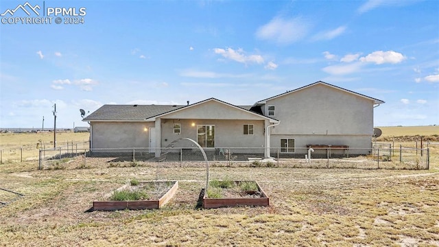 rear view of property with a rural view