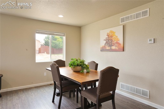 dining room featuring wood-type flooring