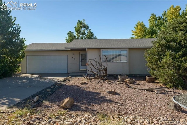 single story home with a garage