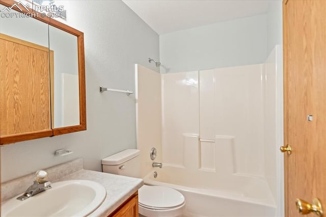 full bathroom with vanity, washtub / shower combination, and toilet