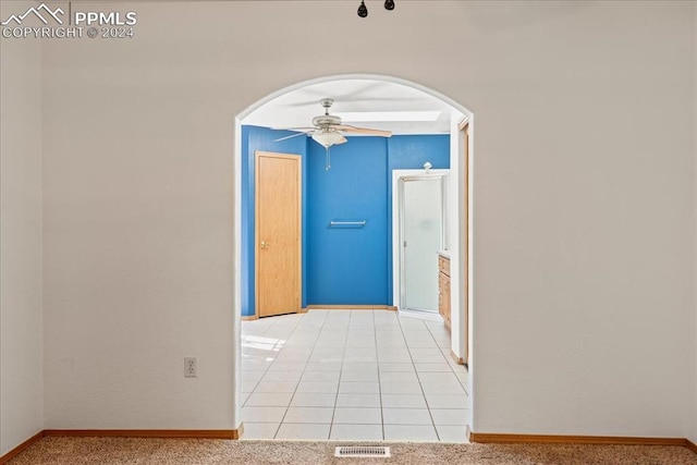 hallway with light colored carpet