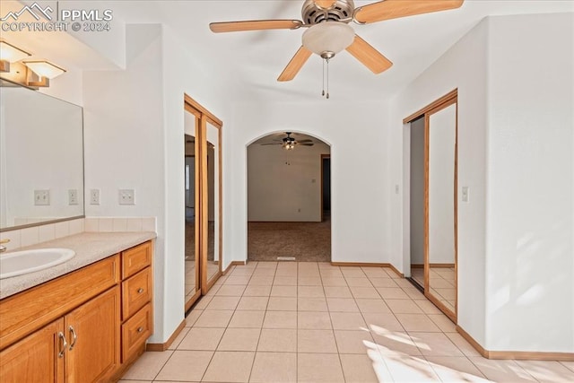 bathroom featuring tile patterned flooring, ceiling fan, and vanity