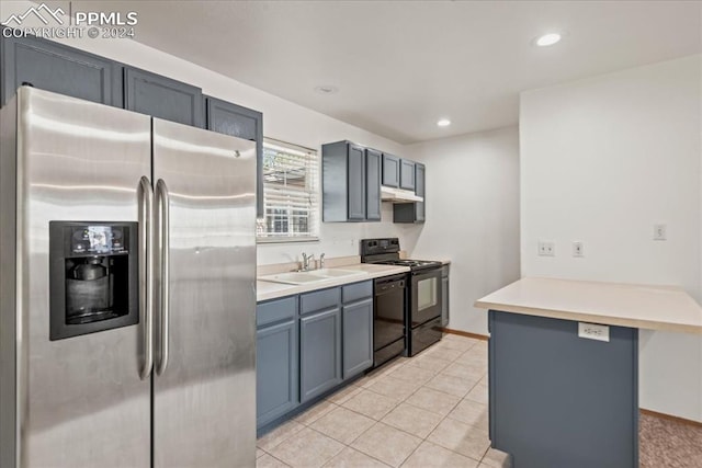 kitchen with light tile patterned flooring, sink, kitchen peninsula, black appliances, and a kitchen breakfast bar