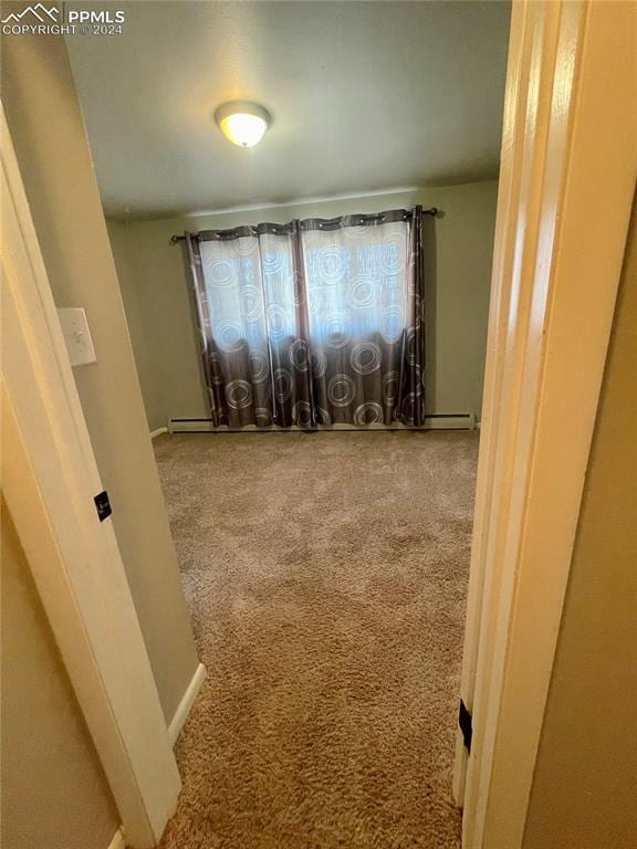 spare room featuring carpet flooring